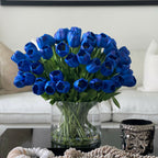 Arrangement of blue tulips in a large cylindrical vase – The Ever Botanic